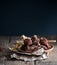 A handmade coffee truffle on an old wooden table.