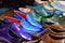 Handmade colorful luxury man shoes in a factory.