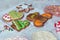 Handmade cookies in the form of a mitten, a Christmas tree, a snowman and a snowflake. Four gingerbread and confectionery decorati