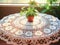 Handmade crochet white lace tablecloth on table with flowers in living room