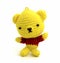 Handmade crochet yellow bear doll isolate on white background