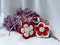 Handmade crocheted flowers with red and white string, known as Martisor.