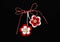 Handmade crocheted flowers with red and white string, known as Martisor.