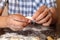 Handmade dumplings and male hands close up mold from raw dough, cooking process