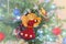 Handmade felt angel Christmas ornament craft hanging from a vintage decorated tree