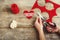 Handmade felt heart on a wooden floor.