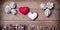 Handmade from felt hearts on wooden background. Craft arranged f