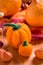 Handmade felt pumpkins for Thanksgiving on orange background
