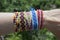 Handmade friendship woven bracelet on the hand, colorful cheep jewelry