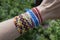 Handmade friendship woven bracelet on the hand, colorful cheep jewelry