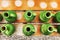 Handmade green pitchers on a wooden table. Top view. Close-up