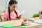 Handmade greeting card and present prepared by little girl for her mother on table