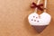 Handmade heart cloth hanging on the side of a cork board symbol romance valentines