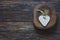 Handmade heart shape on wood slice