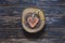 Handmade heart shape on wood slice