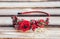 Handmade hoop flowers. Red poppies hair band on wooden background. Ukrainian style