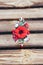 Handmade hoop flowers. Red poppies hair band on wooden background. Ukrainian style. Ukrainian ornament. Top view