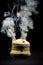 handmade incense bowl hanging with smoke isolated on black background