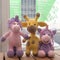 Handmade knitted toys. Yellow giraffe and two unicorns