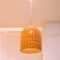 Handmade Lamp Wicker..Vintage Style Room Design. Interior of hanging Lamp illuminated, ceiling light lamp covered with weave.