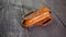 Handmade Leather Pancake Style Swiss Army Knife Sheath on wooden background. Stitching by hand.