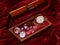 A handmade mahogany casket with watches and diamonds on velvet