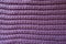 Handmade mauve knitted fabric with horizontal ribbing pattern