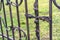 Handmade metal cross on the fence