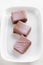 Handmade milk chocolate candy decorated with purple splashes on