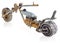 Handmade miniature of a chopper motorcycle. Decorative vehicle made of mechanical parts, bearings, wires, car candles, screws, pla