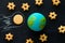 handmade model of Earth planet, cookie meteorite and cookies in the shape of stars on the chalkboard , space and