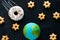 handmade model of Earth planet, donut meteorite and cookies in the shape of stars on the chalkboard , space and