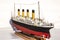 Handmade model of Titanic. Beautiful Handmade model of Titanic isolated on  background