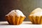 Handmade muffins with powdered sugar on the black background. Sunshine beams and sunlight, selective soft focus. Place for text, c