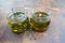 Handmade olive oil candles with herbs.