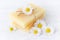 Handmade organic chamomile soap bar with fresh chamomile flowers