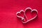 Handmade paper heart shapes decoration on red felt background