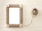 Handmade photo frame braided jute against wooden background