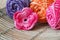 Handmade pink crochet flower with colorful skein