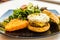 Handmade pork sausage  patty, egg, cheddar, Japanese wheat flour and Taiwan longan blossom honey muffin, with mesclun and crispy