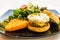 Handmade pork sausage  patty, egg, cheddar, Japanese wheat flour and Taiwan longan blossom honey muffin, with mesclun and crispy