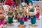 Handmade puppet models of musicians and dancers with traditional costumes made of Jute isolated on blurred background is displayed