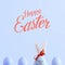Handmade rabbit among Easter eggs, concept of celebration and fun. Text, happy easter