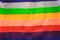 Handmade rainbow colored seamless knitted patterns texture with horizontal rows abstract for sites or blogs. Concept