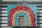 Handmade rainbow sign with stay safe message in front window of a house in London, UK