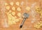 Handmade ravioli and raw dough covered with flour.Wheel dough cutter placed on wooden table.