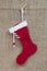 Handmade Santa boot on burlap background for christmas