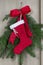 Handmade Santa boot on pine branch background for christmas