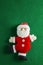 Handmade santa on green background