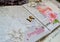 Handmade scrapbooking, wedding photo album. Carvings with pink flowers, ornaments, words, flying, lace, wooden birds and pigeons